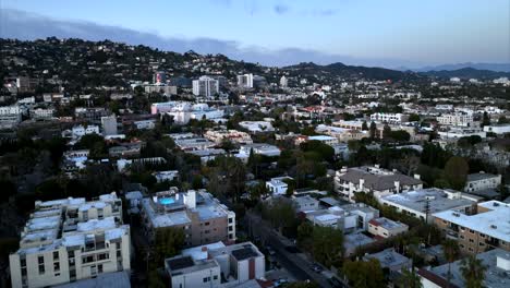 Apartments-in-the-West-Hollywood-neighborhood-foothills---aerial-flyover-at-twilight