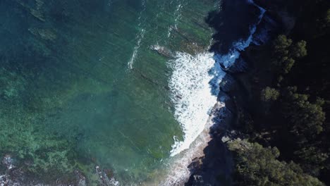 Bird's-eye-view-of-coastal-Flysch-rock-formations-in-ocean-shore-water