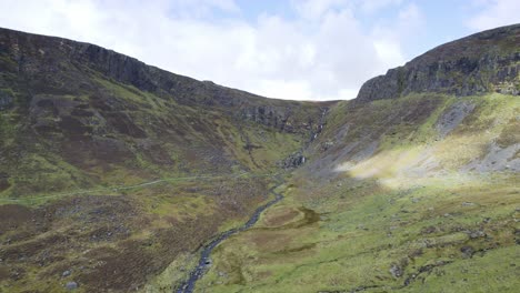 Drone-Establishing-shot-of-the-Mahon-Valley-and-Mahon-Falls-with-trail-to-the-falls-spring-morning