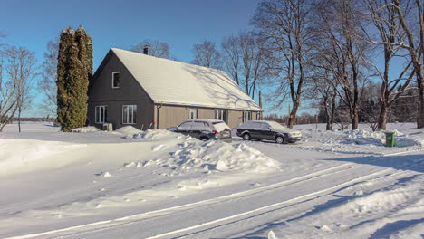 Timelapse--Country-house-and-lawn-covered-in-snow-on-sunny-clear-day