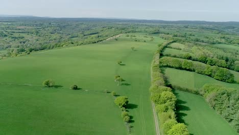 Drone-shot-over-a-vast-green-region-of-Wales,-United-Kingdom
