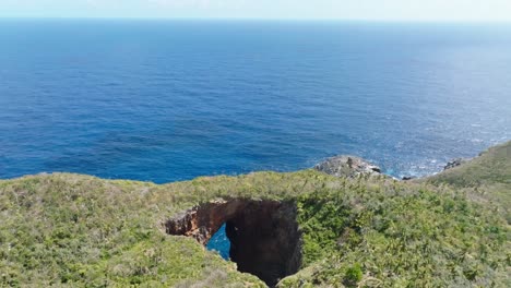 Aerial-shot-cliff-and-shore-in-Cabo-Cabron-National-park,-Samana,-Dominica