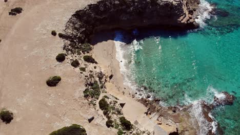 Drone-facing-down-filming-coast-on-Ibiza