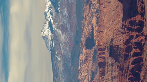 Vertical-4k-Timelapse,-Clouds-Above-Valley,-Red-Rock-Formations-and-Peaks-in-Moab-Area,-Utah-USA