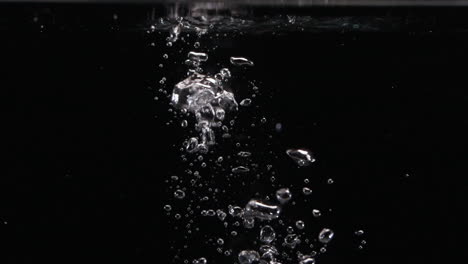 Slow-Motion-Dropping-Car-or-house-Keys-into-River,-Ocean,-Lake-and-Falling-in-Water-with-Bubbles