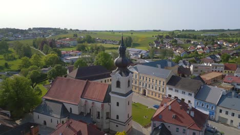 Stunning-aerial-top-view-flight-Church-in-village-Heidenreichstein,-city-in-Austria-Europe,-summer-day-of-2023
