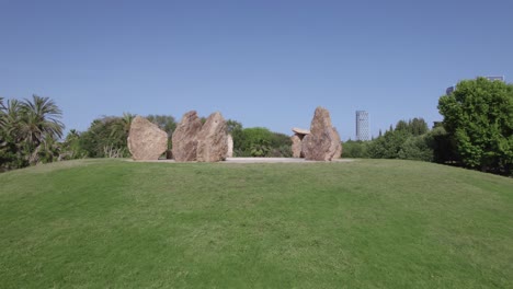 Drone-fly-between-huge-stones-in-Rock-Garden-park-tel-aviv