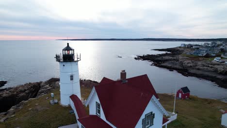 Orbit-of-a-lighthouse-on-a-rocky-island-with-reflecting-waters-in-the-background