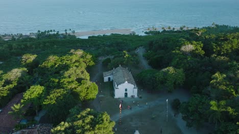 Aerial-Drone-View-of-beach-town-Trancoso-in-Bahia-Brazil-with-church-and-ocean