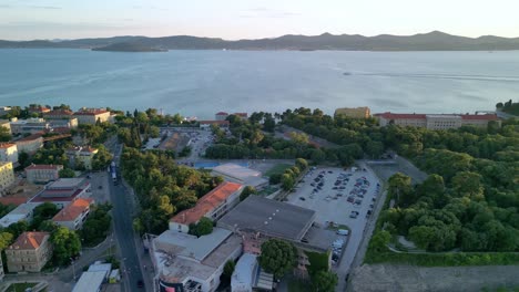 An-aerial-panorama-in-sunset-hours-over-Zadar,-peninsula,-Kolovare,-islands-Ugljan-and-Osljak,-marina-Jazine,-Obala-Penza-Branimira