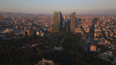 Aerial-scenic-panoramic-view-Mexico-City-Castle,-Chapultepec-forest-and-cityscape-buildings-skyline-background