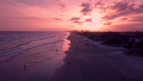 Pink-sky-and-ocean-sunset,-aerial-shot,-Brazil