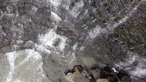 Vertical-View-Looking-Down-Cascading-Waterfall-Rock-Face-Albion-Falls,-Hamilton,-Ontario,-Canada