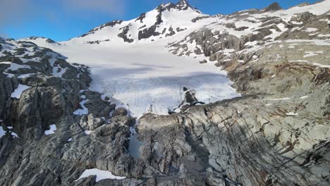 Amazing-Southern-Alps,-New-Zealand-scenery-of-mountain-glacier-hanging-from-Mount-Brewster-peak---aerial-drone