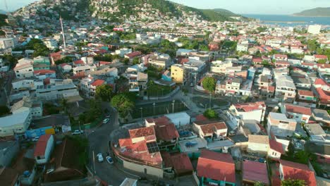Aerial-view-flyover-Arraial-do-Cabo-scenic-island-city-property-rooftops,-Rio-de-Janeiro,-Brazil