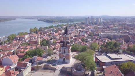 Establishing-orbiting-4k-aerial-shot-of-Gardos-Tower-in-Zemun-Old-city,-Belgrade-summer-day