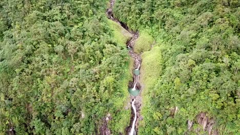 Path-of-the-water-between-two-waterfalls-filmed-with-a-drone,-Carbet-falls-Guadeloupe