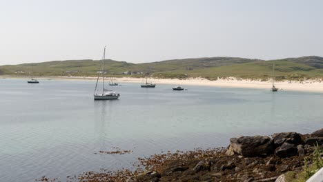 Shot-of-the-yachts-anchored-at-Vatersay-beach-near-Castlebay-on-the-island-of-Barra