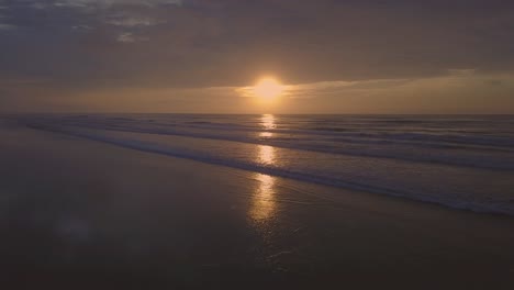 Slow-motion-4k-drone-shot-of-beautiful-Atlantic-ocean-and-beach-in-Brazil,-crazy-color-sunrise