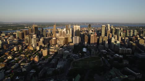 Aerial-view-overlooking-the-Centre-Ville-of-Montreal-city,-golden-hour-in-Canada