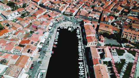 Aerial-shot-of-a-busy-port-within-the-city-center-of-Meze,-France