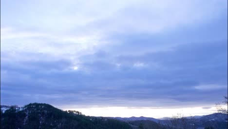 Sunrise-in-the-mountain-in-winter,-time-lapse