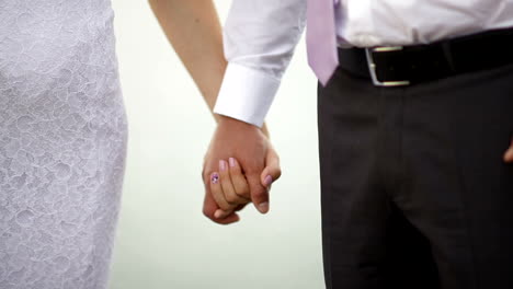 Bride-and-groom-holding-hands