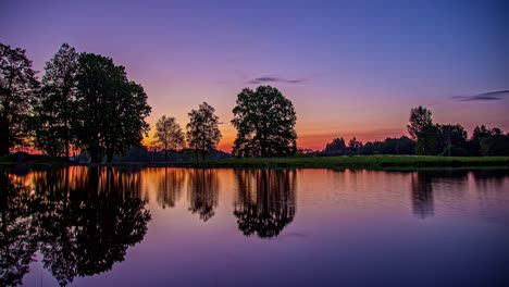 Pond-reflection-and-trees-sunrise-timelapse