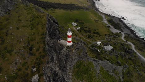 Cape-Palliser-lighthouse-aerial-orbit,-New-Zealand
