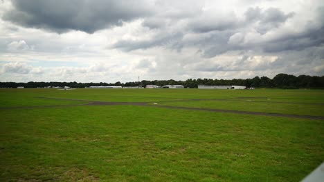 shot-over-a-small-airfield-with-a-meadow