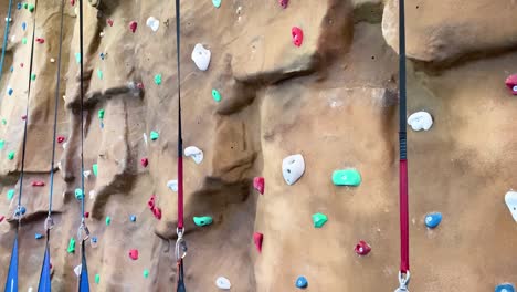Tilting-shot-showing-empty-multiple-climbing-wall-positions-in-an-indoor-course