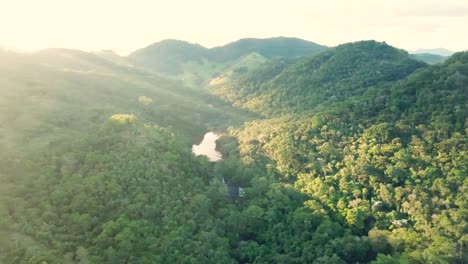 Stunning-high-panorama-aerial-shot-of-sunset-and-beautiful-Brazilian-hills-and-green-nature