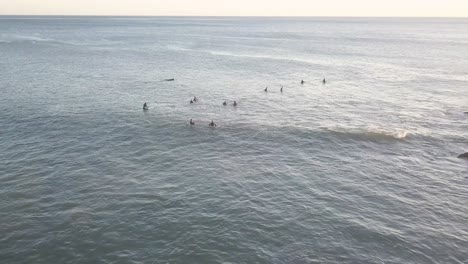 Aerial-view-of-surfers-in-the-ocean-waiting-for-waves
