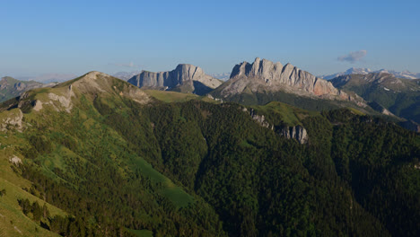 Panoramic-landscape-view-of-the-rocky-Caucasus-Mountains-valleys-and-forests,-on-a-sunny-day