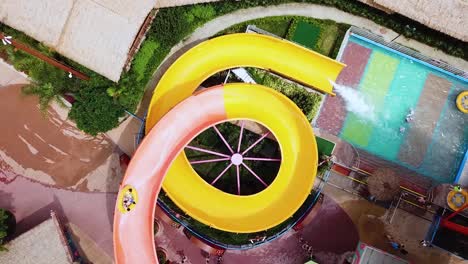 Birdseye-view-of-some-people-sliding-down-a-water-slide-at-the-Chimelong-Water-Park-in-Guangzhou,-China