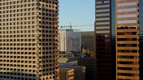 Drone-shot-in-middle-of-buildings-in-downtown-Phoenix,-in-sunny-Arizona,-USA