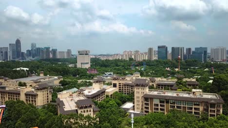 Aerial-revealing-shot-of-the-Guangzhou-skyline-near-the-Chimelong-Water-Park-in-Guangzhou,-China