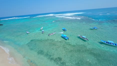 Boats-anchored-at-Playa-Fronton-beach,-Samana-in-Dominican-Republic