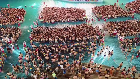 Drone-shot-of-the-water-park-festival-and-concert-at-the-Chimelong-Water-Park-in-Guangzhou,-China