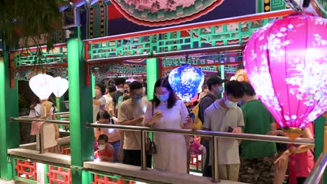 Residents-and-Chinese-visitors-are-seen-at-the-Wong-Tai-Sin-public-park-decorated-with-Chinese-lanterns-at-a-nighttime-lantern-show-during-the-Mid-Autumn-Festival-