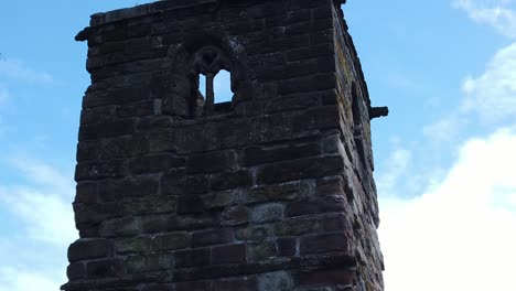 Historic-Windleshaw-Chantry-stonework-tower-exterior-against-blue-sky