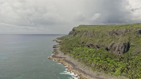 Cliffs-near-Playa-Fronton-beach-on-cloudy-day,-Las-Galeras