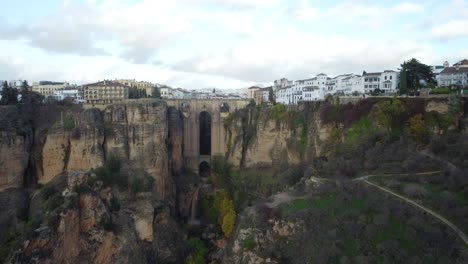 Majestic-Ronda-city-on-steep-cliff-side-in-Spain,-aerial-drone-view