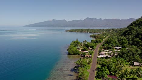 Stunning-Aerial-View-of-a-Beachside-Road-in-Tahiti-and-the-Coral-Reefs-of-Tahiti-Iti