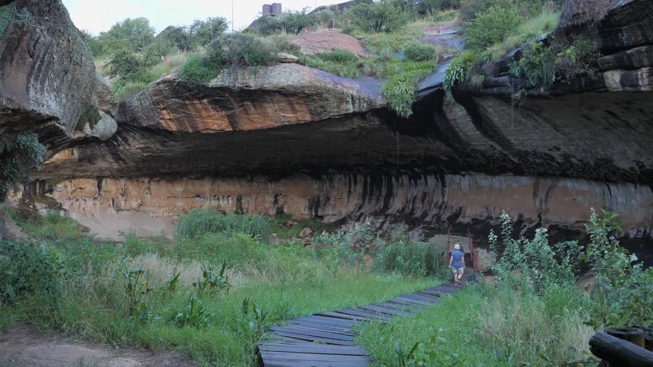 Tourist Walks Path With Guide In Liphofung Cave In Northern Lesotho Free  Stock Video Footage Download Clips Holidays