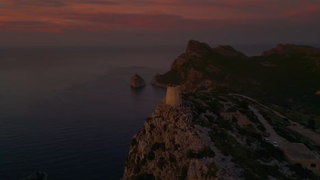 Sunset-at-Es-Colomer-Island-Albercutx-watchtower,-Cap-Formentor,-Mallorca,-Spain