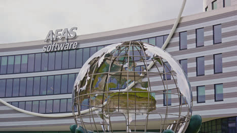 Low-angle-view-of-the-AFAS-software-headquarters-with-a-giant-statue-in-front-of-the-office-building