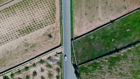 Drone-shot-of-roads-with-fields-on-the-side-on-Formentera