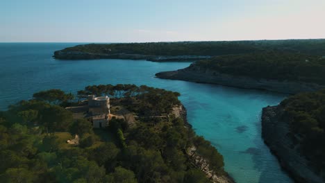 Remote-natural-bay,-clear-turquoise-blue-sea-water,-sailing-boat-yacht,-Palma-de-Mallorca-Island