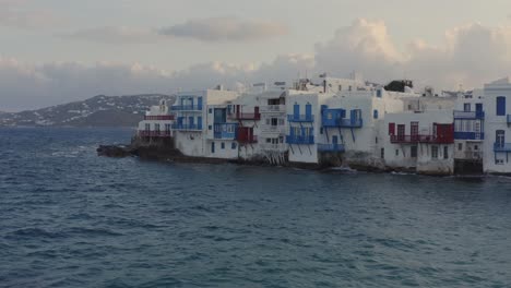 Little-Venice-in-Mykonos-at-sunrise-with-colorful-clouds-behind